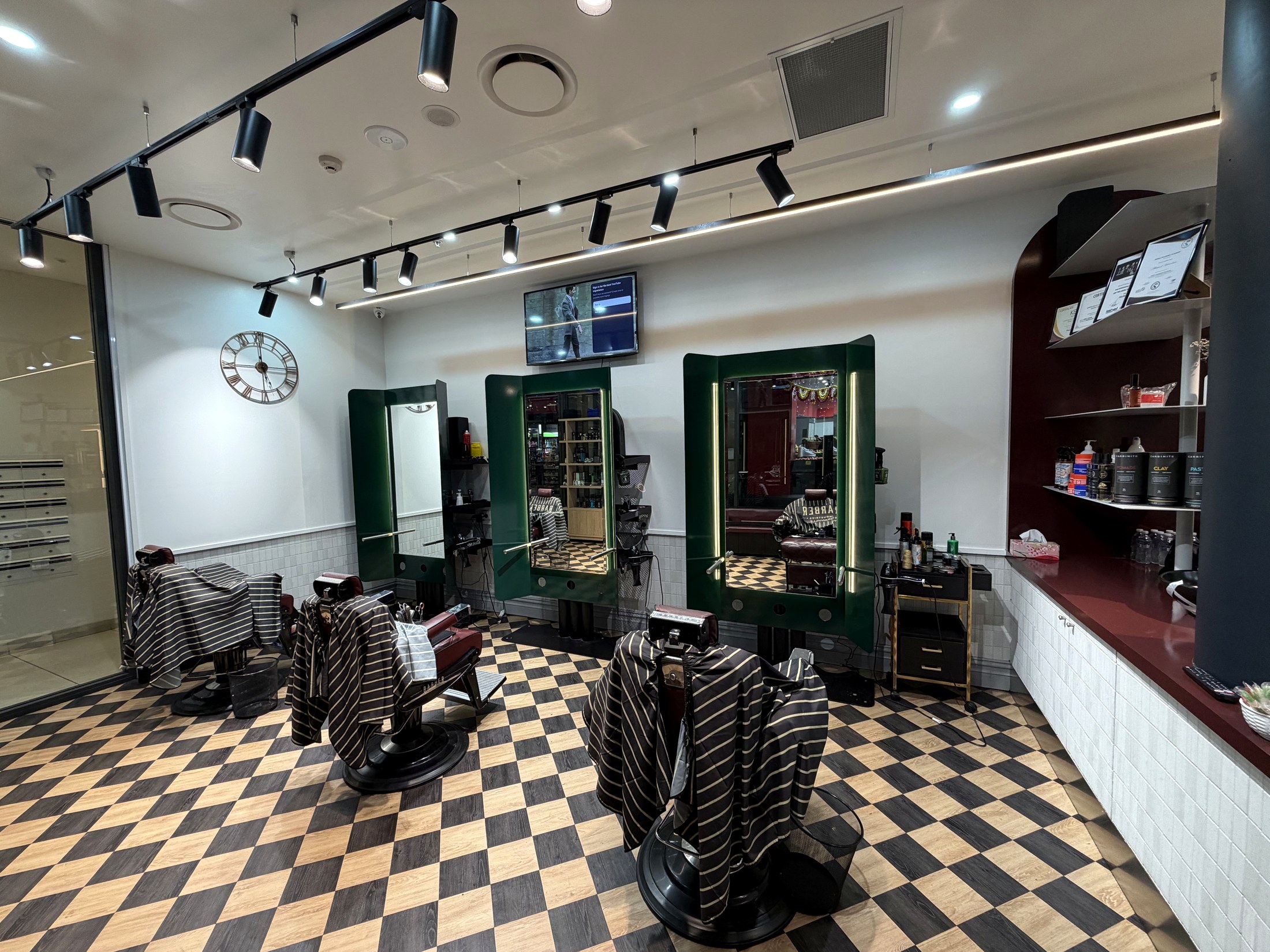 Barber chairs and mirrors inside the Granville shop